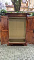Antique 17th-century wardrobe from Parma, made of paneled and rusticated walnut