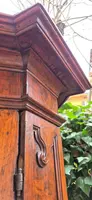 Antique 17th-century wardrobe from Parma, made of paneled and rusticated walnut