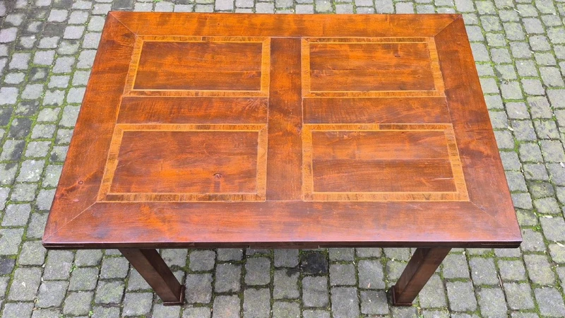 Antique extendable Empire-style table with a filleted tabletop