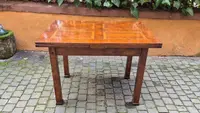Antique extendable Empire-style table with a filleted tabletop