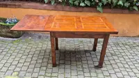 Antique extendable Empire-style table with a filleted tabletop
