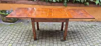 Antique extendable Empire-style table with a filleted tabletop