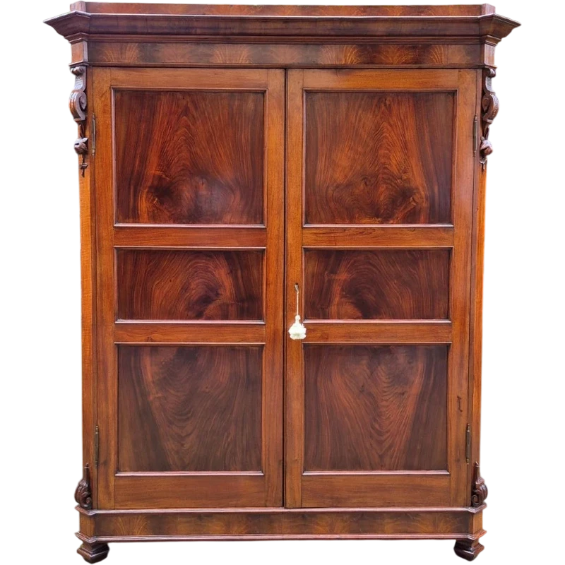 Antique Emilian walnut cabinet with carved garlands