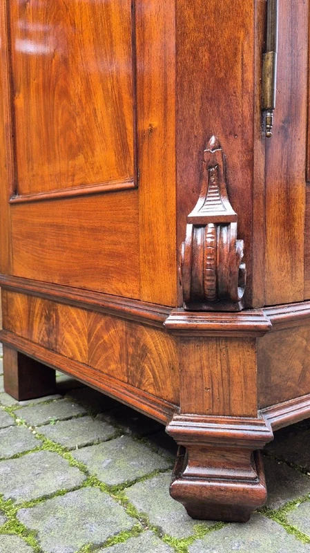Antique Emilian walnut cabinet with carved garlands