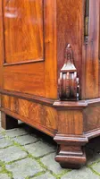 Antique Emilian walnut cabinet with carved garlands