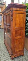 Antique Emilian walnut cabinet with carved garlands