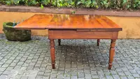 Antique square extendable table with an Emilian-style pull-out mechanism, made of cherry wood