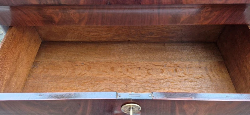 Antique 19th-century chest of drawers with a groove and a drop-down panel