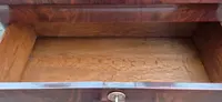 Antique 19th-century chest of drawers with a groove and a drop-down panel