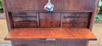 Antique 19th-century chest of drawers with a groove and a drop-down panel