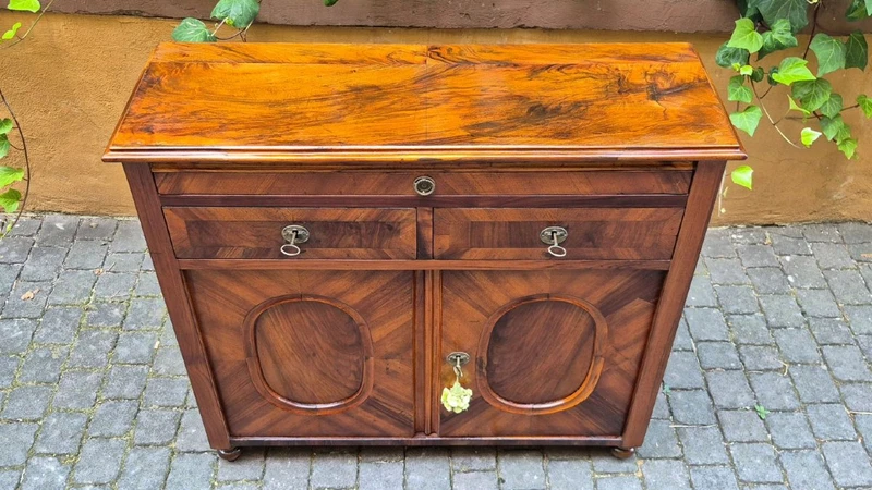 Narrow antique sideboard with walnut veneer
