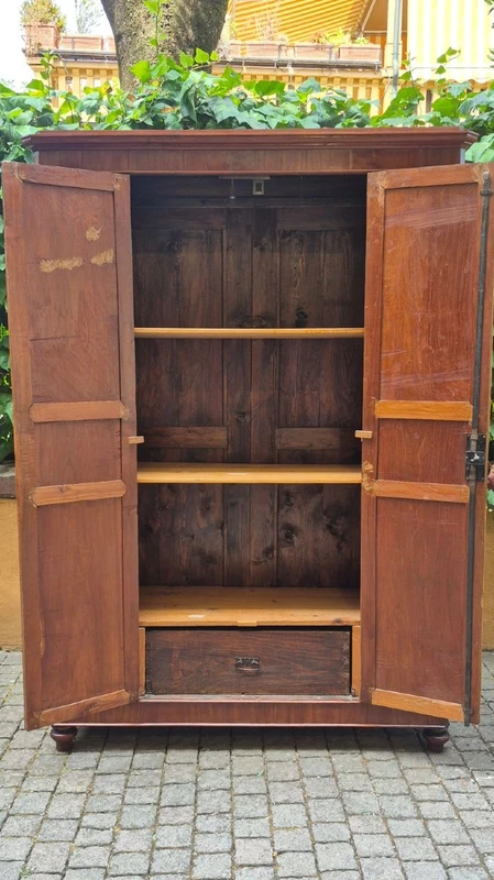 Antique cherry wood paneled pantry cabinet
