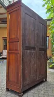 Antique cherry wood paneled pantry cabinet