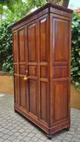 Antique cherry wood paneled pantry cabinet