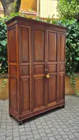 Antique cherry wood paneled pantry cabinet