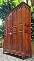 Antique cherry wood paneled pantry cabinet