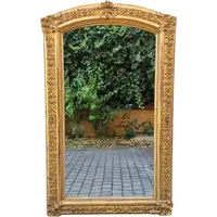 Antique gilded 19th-century mirror with an arched cornice