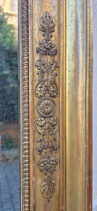 Antique gilded Empire-style mirror with a mercury mirror