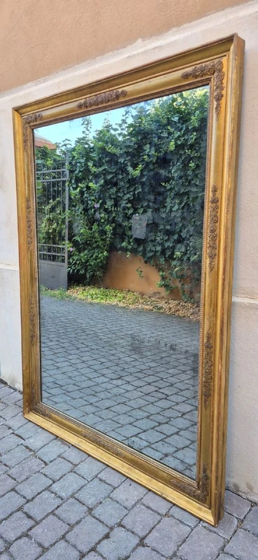 Antique gilded Empire-style mirror with a mercury mirror