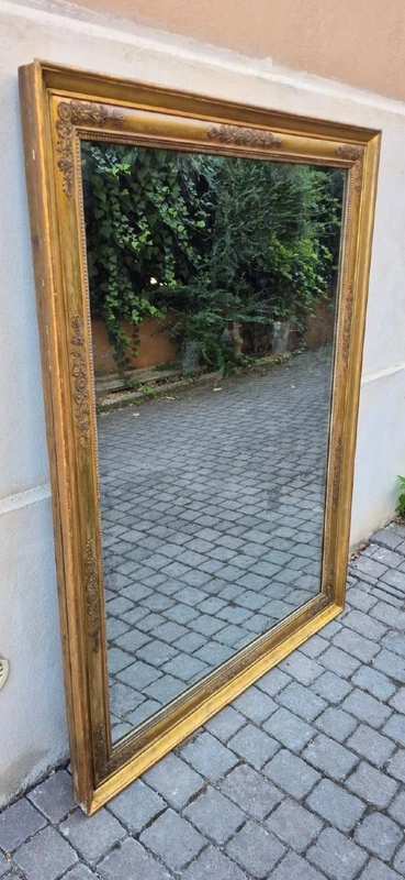 Antique gilded Empire-style mirror with a mercury mirror