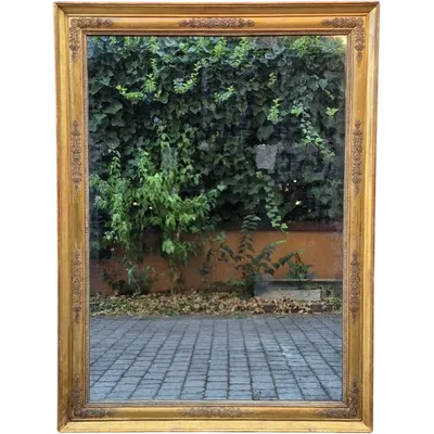 Antique gilded Empire-style mirror with a mercury mirror