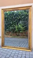 Antique gilded Empire-style mirror with a mercury mirror