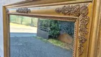 Antique gilded Empire-style mirror with a mercury mirror