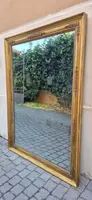 Antique gilded Empire-style mirror with a mercury mirror