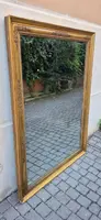 Antique gilded Empire-style mirror with a mercury mirror