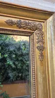 Antique gilded Empire-style mirror with a mercury mirror