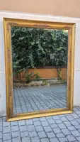 Antique gilded Empire-style mirror with a mercury mirror