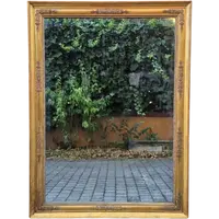 Antique gilded Empire-style mirror with a mercury mirror