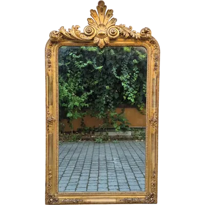 Large antique gilded mirror from the 19th century with a cornice
