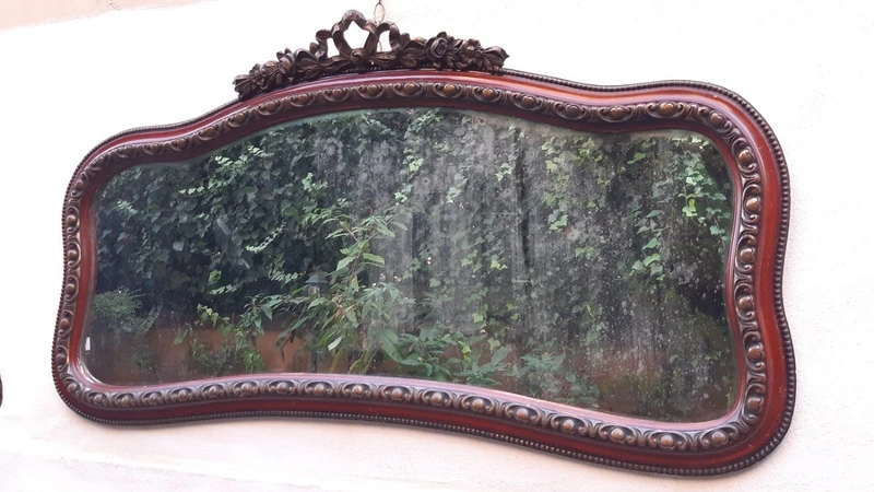Antique horizontal mirror from the 19th century with a cornice