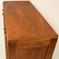 Antique oak filing cabinet with sliding doors