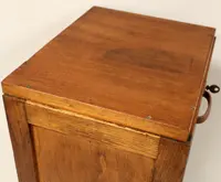 Antique oak filing cabinet with sliding doors