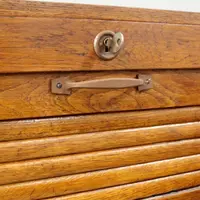 Antique oak filing cabinet with sliding doors