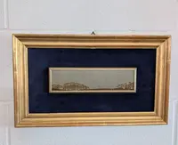 A small Tuscan village in a 19th-century gilded frame
