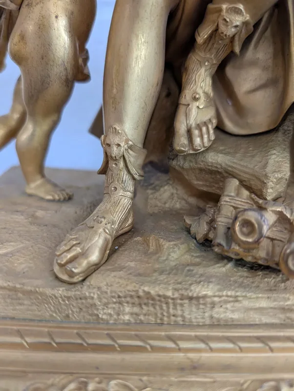 Gilt bronze mantel clock with female figure and putti