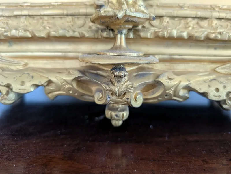 Gilt bronze mantel clock with female figure and putti