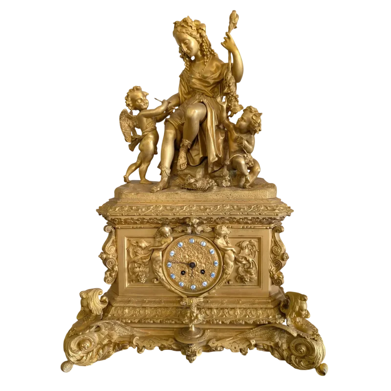 Gilt bronze mantel clock with female figure and putti