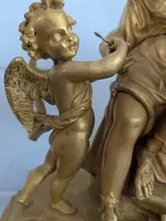 Gilt bronze mantel clock with female figure and putti