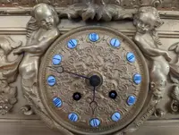 Gilt bronze mantel clock with female figure and putti