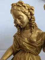 Gilt bronze mantel clock with female figure and putti