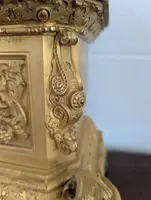 Gilt bronze mantel clock with female figure and putti