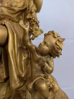 Gilt bronze mantel clock with female figure and putti