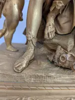 Gilt bronze mantel clock with female figure and putti