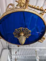 Six-light gilt bronze and blue enameled glass chandelier