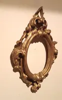 Cornice antica ovale dorata e intagliata Luigi XIV -Toscana XVII secolo
