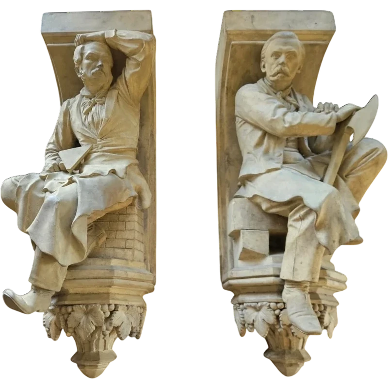 Coppia di elementi scultorei in terracotta – Firmati e datati 1866 “W. Wolff”